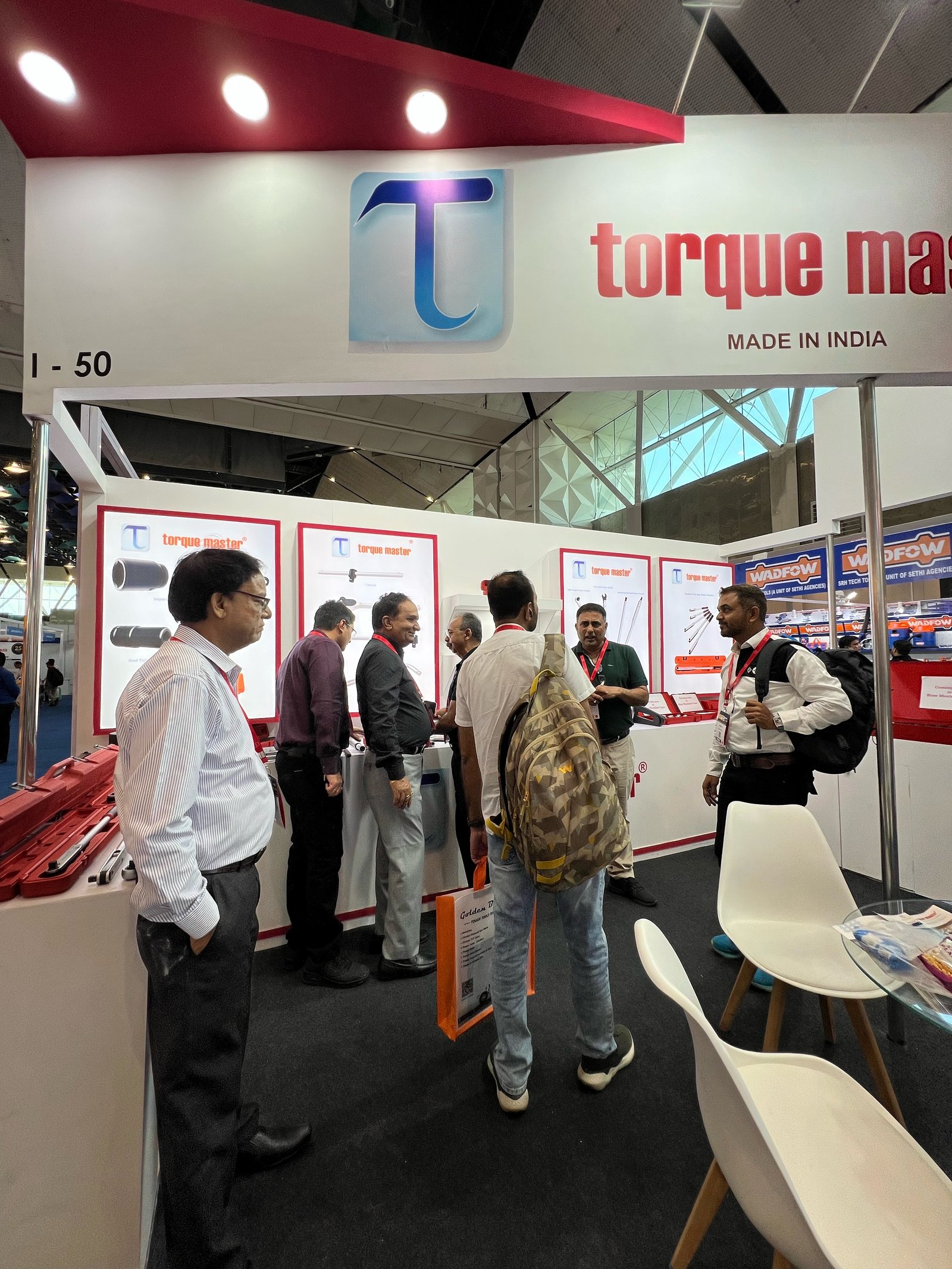 Torque Master stall I-50 at an expo in Delhi, 2024, with the Torque Master Made in India fascia and visitors at the product displays
